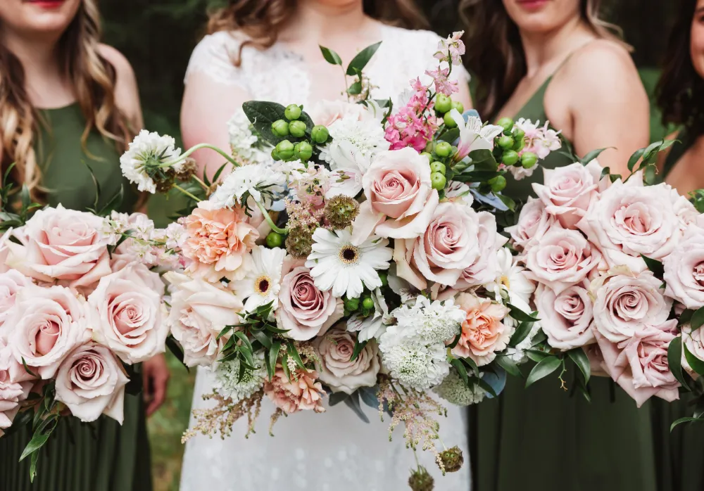 bride and bridal party holding bouquets