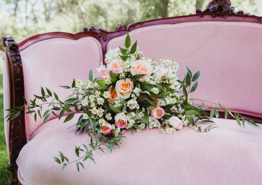 bouquet on pink couch